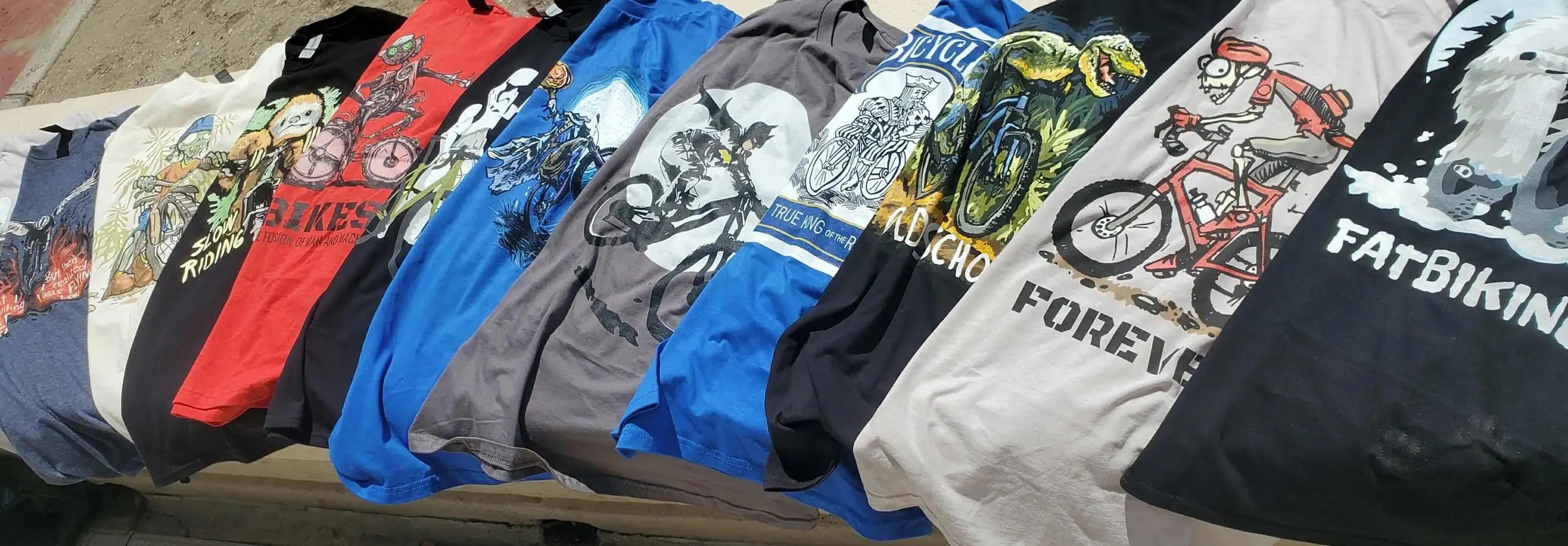 Geeks'n'Gears Bicycle T-Shirts hero image representing a stack of biket-shirts